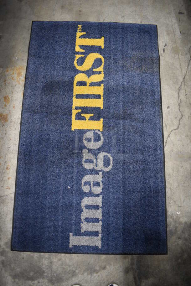Blue Floor Rug w/ Image First Logo. 56x33