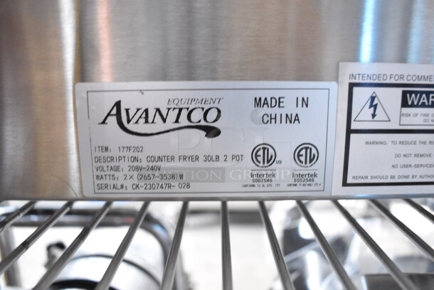 BRAND NEW SCRATCH AND DENT! 2023 Avantco 177F202 Stainless Steel Commercial Countertop Electric Powered 2 Bay Fryer w/ Lids and Metal Fry Baskets. 208-240 Volts, 1 Phase. Tested and Working! - Image 6 of 6
