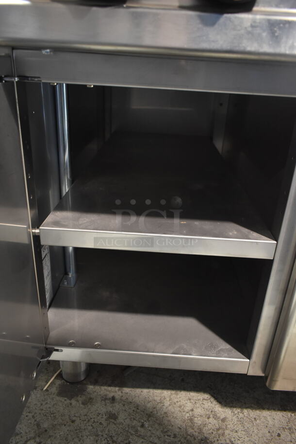Lotus Stainless Steel Commercial Gas Powered 4 Burner Range w/ Center Burner, Under Shelf and 3 Doors. - Image 4 of 6