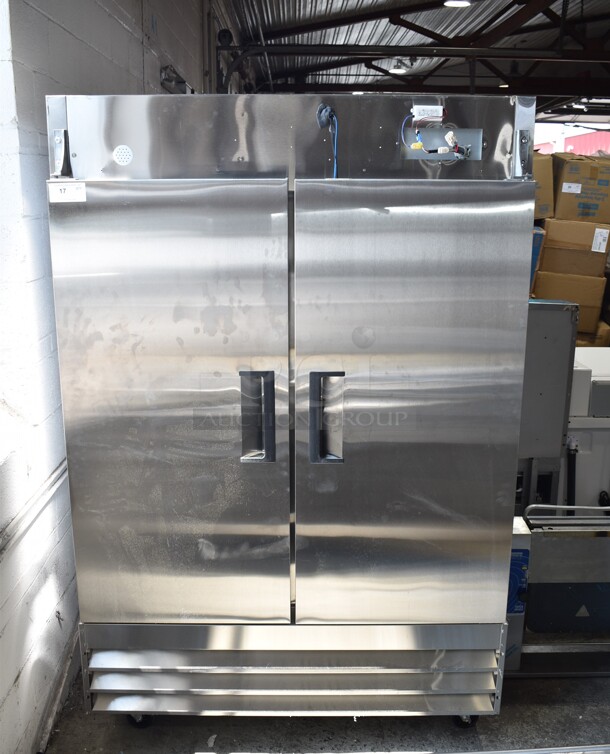 BRAND NEW SCRATCH AND DENT! 2024 Avantco 178A49FHC Stainless Steel Commercial 2 Door Reach In Freezer w/ Poly Coated Racks on Commercial Casters. 115 Volts, 1 Phase. Cannot Test - Interior Pieces are Detached - Image 2 of 9