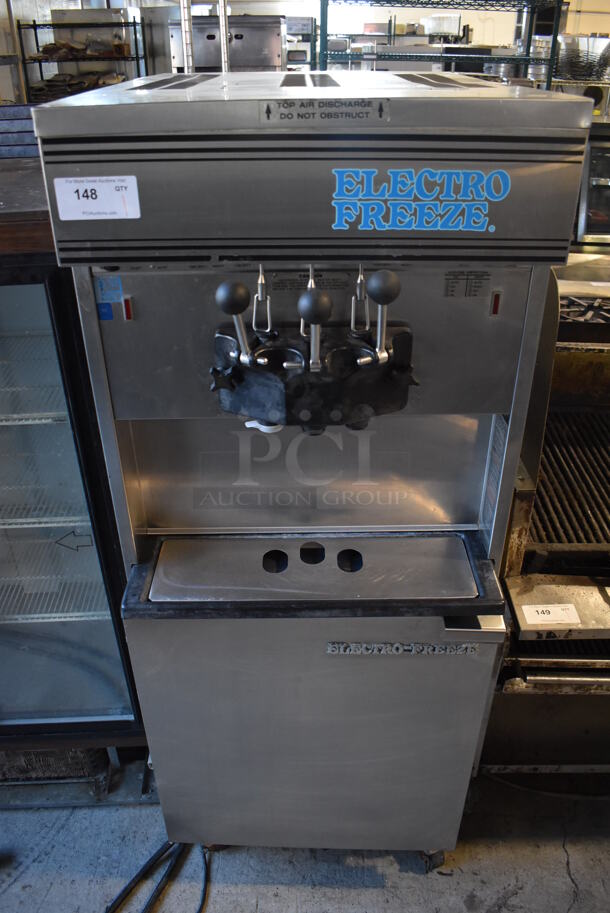 Electro Freeze 30TA-GAB-SS Stainless Steel Commercial Floor Style 2 Flavor w/ Twist Soft Serve Ice Cream Machine on Commercial Casters. 208/230 Volts, 1 Phase. 26x38x68