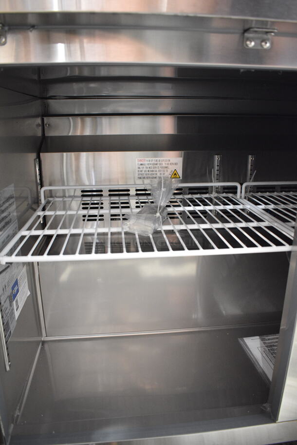 BRAND NEW SCRATCH AND DENT! 2024 Avantco 178SSUC48FHC Stainless Steel Commercial 2 Door Undercounter Freezer on Commercial Casters. 115 Volts, 1 Phase. Tested and Working!  - Image 5 of 6