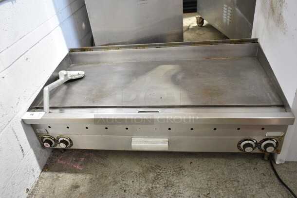 Vulcan Stainless Steel Commercial Countertop Natural Gas Powered Flat Top Griddle w/ Scraper.  - Image 1 of 4