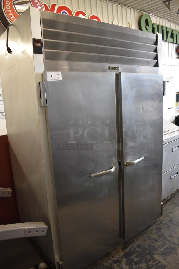 Traulsen Model G22010 ENERGY STAR Stainless Steel Commercial 2 Door Reach In Freezer w/ Poly Coated Racks and Commercial Casters. 115 Volts, 1 Phase. 52x34x77. Tested and Working!