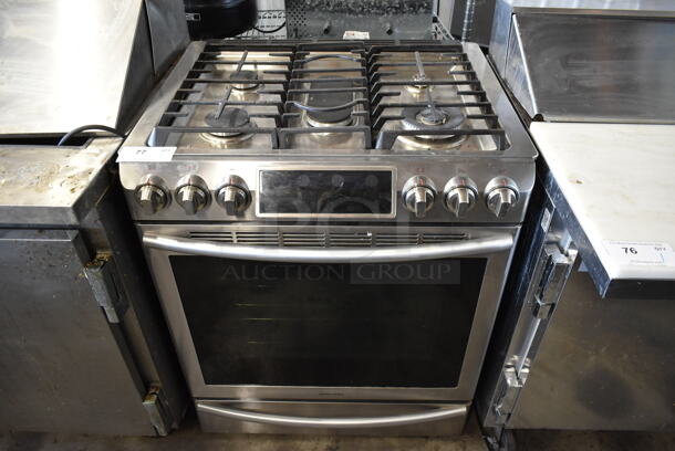 Samsung Stainless Steel Natural Gas Powered 4 Burner Range w/ Oven. - Image 1 of 10