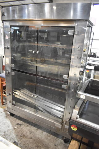 Rotisol 1350.8 Stainless Steel Commercial Floor Style Natural Gas Powered Rotisserie Oven on Commercial Casters. 
