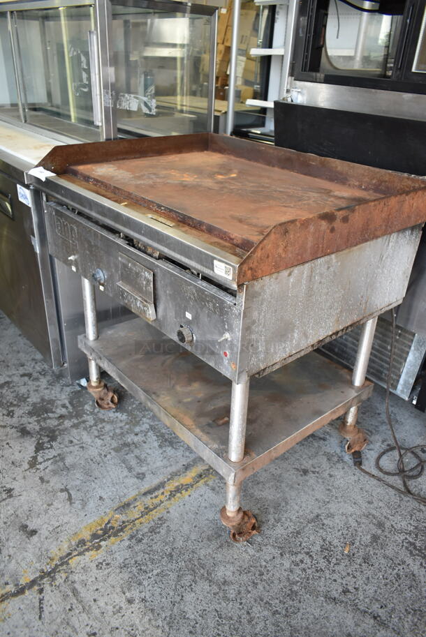 Lang G-3E Stainless Steel Commercial Natural Gas Powered Flat Top Griddle w/ Metal Under Shelf on Commercial Casters. 27,000 BTU.  - Image 2 of 5