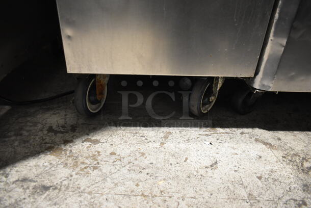 Pitco Frialator 14S Stainless Steel Commercial Floor Style Natural Gas Powered Deep Fat Fryer w/ Side Splash Guards on Commercial Casters. 110,000 BTU. - Image 6 of 8