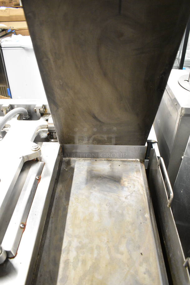 2015 Garland XG36 Stainless Steel Commercial Floor Style Natural Gas Powered  Xpress 36" Semi Automatic Triple Clamshell Grill Griddle on Commercial Casters.   - Image 3 of 12