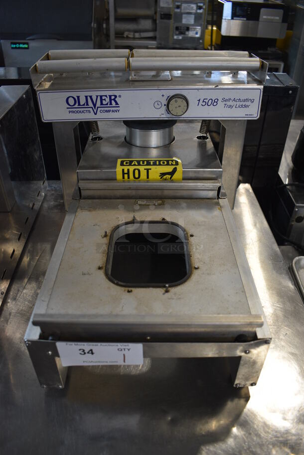 Oliver Model 1508 Metal Commercial Countertop Self-Actuating Tray Lidder. 120 Volts, 1 Phase. 16x28x14. Tested and Working!