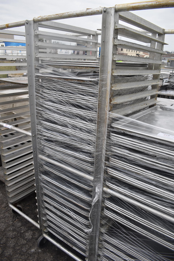 Metal Commercial Pan Transport Rack  w/ 55 Full Size Metal Baking Pans on Commercial Casters. 21x27x70 - Image 1 of 3