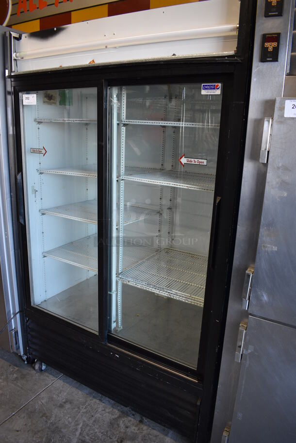 True Model GDM-45 Metal Commercial 2 Door Cooler Merchandiser w/ Sliding Doors and Poly Coated Racks on Commercial Casters. 115 Volts, 1 Phase. 51.5x31x82.5. Tested and Working! - Image 2 of 6