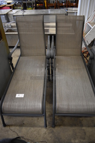 2 Gray Chaise Patio Chairs w/ Arm Rests. 28x64x43. 2 Times Your Bid!