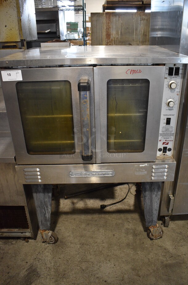 Southbend Stainless Steel Commercial Natural Gas Powered Full Size Convection Oven w/ View Through Doors, Metal Oven Racks and Thermostatic Controls on Metal Legs w/ Commercial Casters. 38x35x58