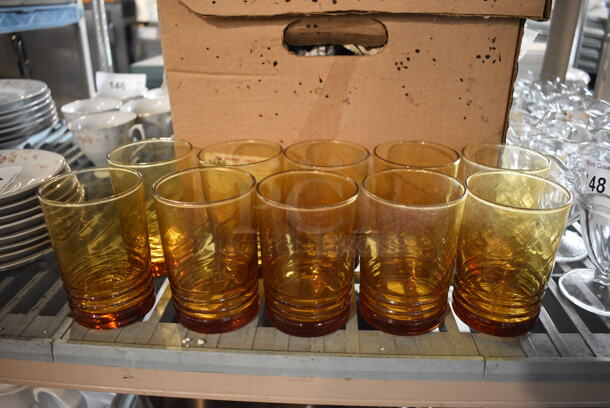76 Amber Colored Beverage Glasses. 3x3x4. 76 Times Your Bid!