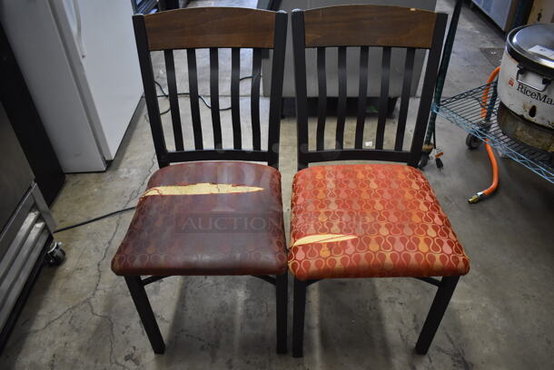 2 Black Metal Dining Chairs w/ Wood Pattern Top Back Rest Piece and Red Patterned Seats. 17x20x36. 2 Times Your Bid! 