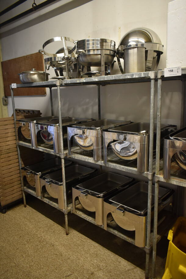 Chrome Finish 3 Tier Wire Shelving Unit w/ Contents Including Chafing Dishes. BUYER MUST REMOVE: BUYER MUST DISMANTLE. PCI CANNOT DISMANTLE FOR SHIPPING. PLEASE CONSIDER FREIGHT CHARGES. (hallway) - Image 1 of 4