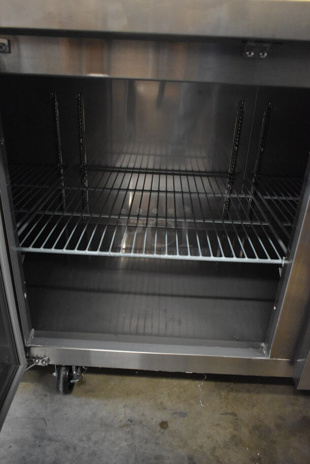 BRAND NEW SCRATCH AND DENT! 2023 Avantco 178SSPPT3 Stainless Steel Commercial Refrigerated Pizza Prep Table on Commercial Casters. 115 Volts, 1 Phase. Tested and Working! - Image 10 of 12