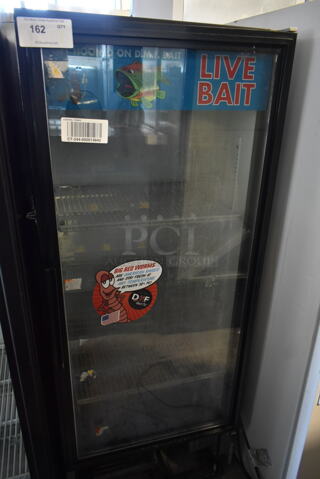 True GDM-12 Metal Commercial Single Door Reach In Cooler Merchandiser w/ Poly Coated Racks. 115 Volts, 1 Phase. Tested and Powers On But Does Not Get Cold