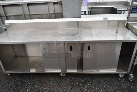 Stainless Steel Commercial Table w/ Back Splash, Under Shelf and 2 Doors on Commercial Casters.