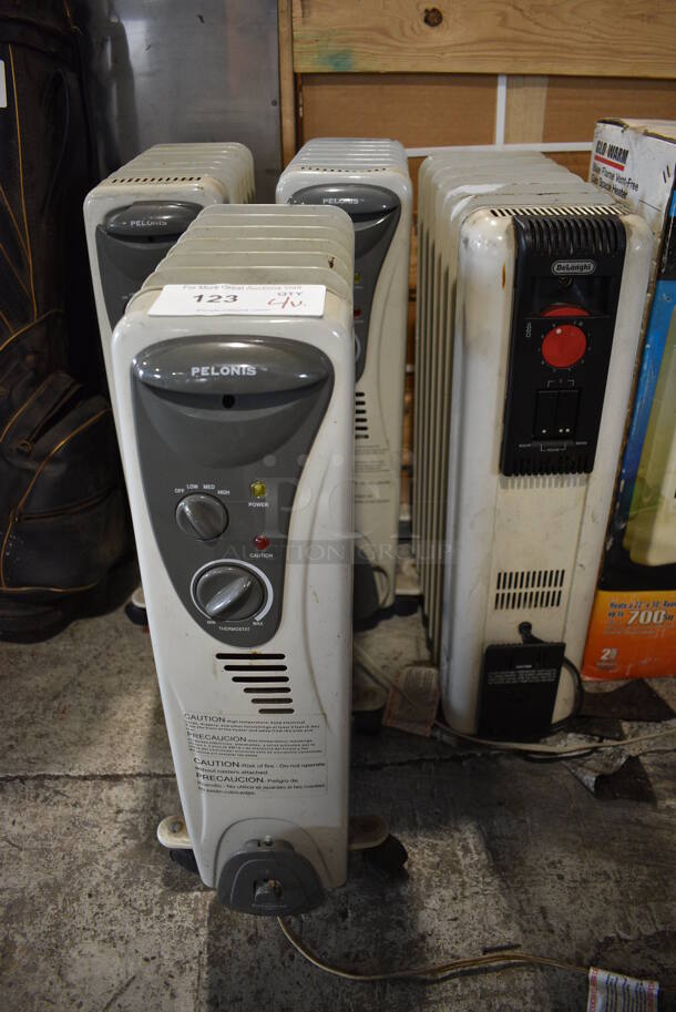 4 Various Electric Radiators; 3 Pelonis and 1 DeLonghi. Includes 6.5x16x26. 4 Times Your Bid!