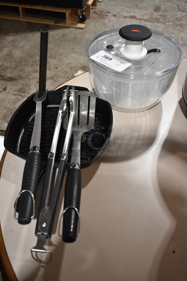ALL ONE MONEY! Lot of Clear Poly Salad Spinner, Steak Fork, Spatula, Tongs and Lodge Cast Iron Skillet. - Image 2 of 9