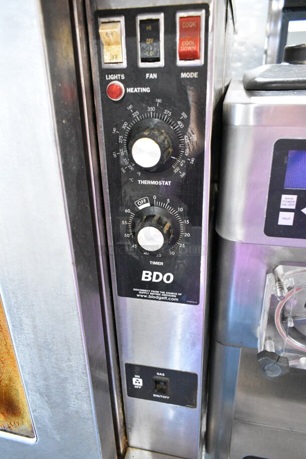 Blodgett BDO-100-G-ES Stainless Steel Commercial Natural Gas Powered Full Size Convection Oven w/ View Through Doors, Thermostatic Controls and Metal Legs on Commercial Casters.  - Image 6 of 7