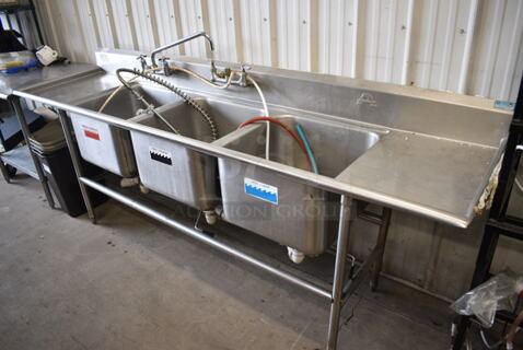 Stainless Steel Commercial 3 Bay Sink w/ Dual Drainboards, Faucet, Handles and Spray Nozzle Attachment. 102x27x40.5. Bays 20x20x14. Drainboards 16x23x2
