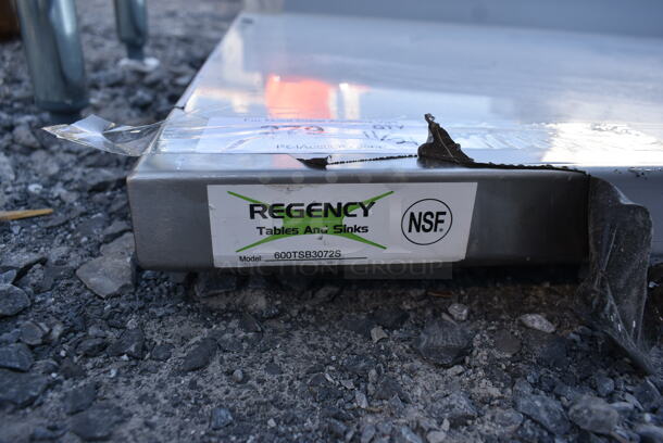 BRAND NEW SCRATCH AND DENT! Regency 600TSB3072S Stainless Steel Commercial Tabletop w/ Back Splash and Under Shelf. - Image 4 of 4