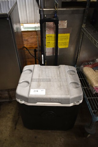 Black and White Poly Portable 52 Quart Roller Cooler.