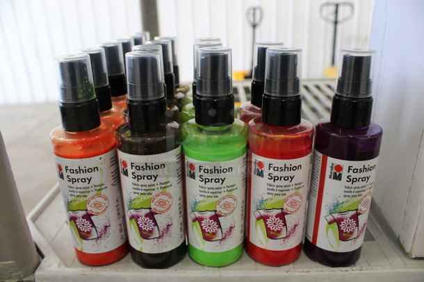 15 BRAND NEW Bottles of Fashion Fabric Paint Spray. 5 Orange, 4 Brown, 3 Green, 2 Red and 1 Purple. 1.5x1.5x5.5. 15 Times Your Bid!