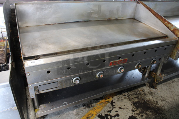 Vulcan Stainless Steel Commercial Natural Gas Powered Flat Top Griddle w/ Metal Under Shelf on Commercial Casters. 60x30x46