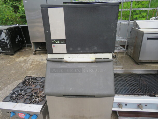 One Ice O Matic Ice Maker With Bin. Model# ICE0606HT2. 208-230 Volt. Missing 1 Side Panel, And Small Piece Up Front. Unable To Test. 30X34X58 - Image 1 of 3