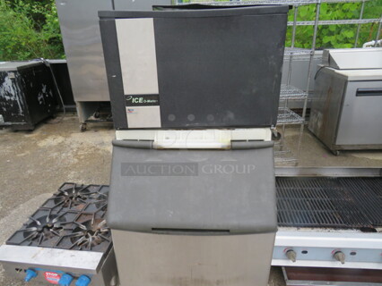 One Ice O Matic Ice Maker With Bin. Model# ICE0606HT2. 208-230 Volt. Missing 1 Side Panel, And Small Piece Up Front. Unable To Test. 30X34X58