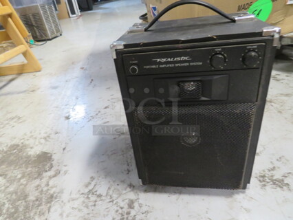 One Realistic Portable Amplified Speaker.