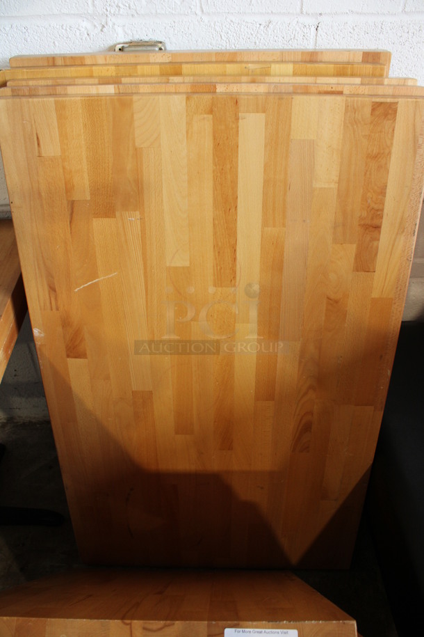 Wooden Butcher Block Tabletop and 2 Black Metal Straight Table Bases. Table Is Disassembled. 48x30x30. Tabletop 48x30x2, Table Bases 22x13x28 - Image 1 of 3