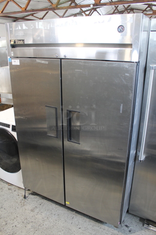 2012 True TG2R-2S ENERGY STAR Stainless Steel Commercial 2 Door Reach In Cooler w/ Poly Coated Racks on Commercial Casters. 115 Volts, 1 Phase. Tested and Powers On But Does Not Get Cold