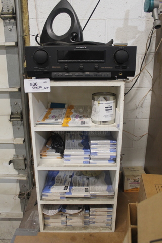 White Bookshelf w/ Contents Including Magnavox Radio and Labels.