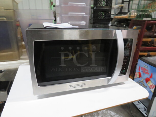 One WORKING Black And Decker Microwave With Manual. 1000Watt. 120 Volt. Model# EM034AJ2-X. 20.5X18X12 - Image 1 of 3