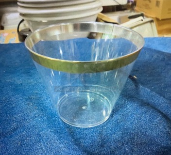 One Lot Of 9oz Gold Rimmed Poly Cups.