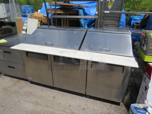 One 3 Door Turbo Air Refrigerated Prep Table With 2 Racks, And A Cutting Board On Casters. Model# MST-72-30M. 115 Volt. 73X38X45. - Image 2 of 2