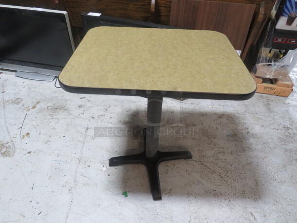 One Beige Laminate Table Top On A Pedestal Base. 24X30X29