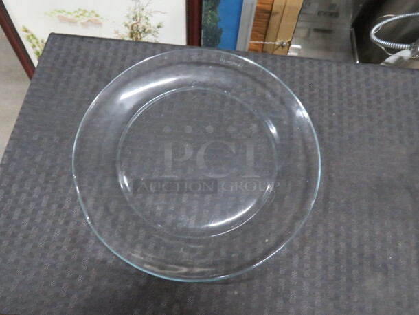 10 Inch Round Clear Glass Plate. 12XBID - Image 1 of 1