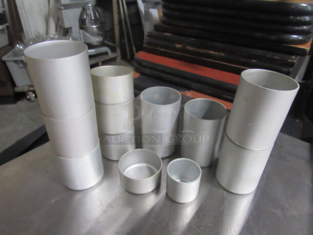 One Lot Of Assorted Size Aluminum Cylinders.
