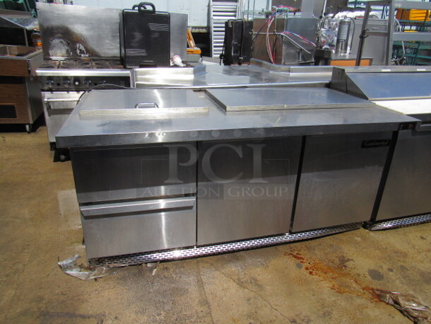 One SS Continental 2 Door, 2 Drawer Continental Refrigerated Prep Table With 2 Racks. Missing 1 Handle. 115 Volt. Model# SW72-30M. 72X36X35.