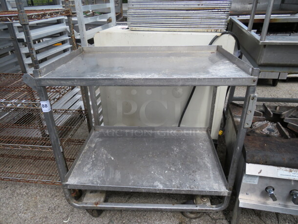 One Stainless Steel Table With SS Undershelf On Casters. 37.5X21X38