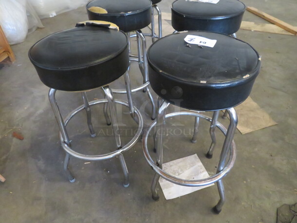 Chrome Bar Stool With A Footrest, And A Black Cushioned Swivel Seat. 2XBID
