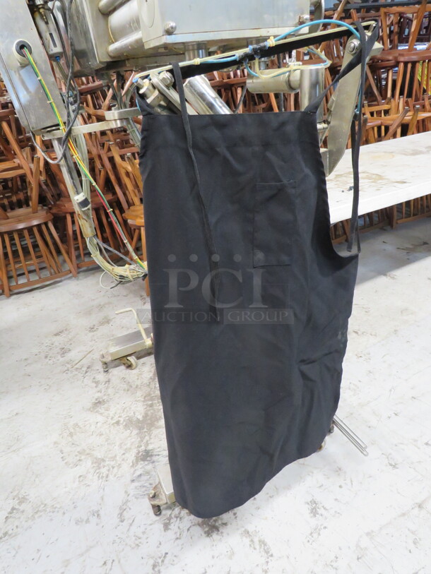 One Lot Of 8 Black Aprons. - Image 1 of 1