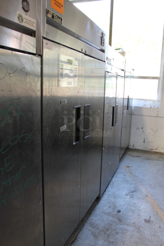 True TG2R-2S Stainless Steel Commercial 2 Door Reach In Cooler w/ Poly Coated Racks on Commercial Casters. 115 Volts, 1 Phase. Tested and Working!