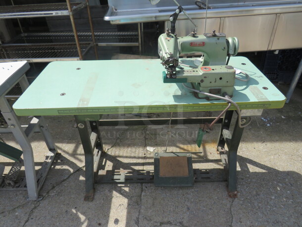 One Lewis Union Special Sewing Machine On A Table. #150-5. 48X20X41.